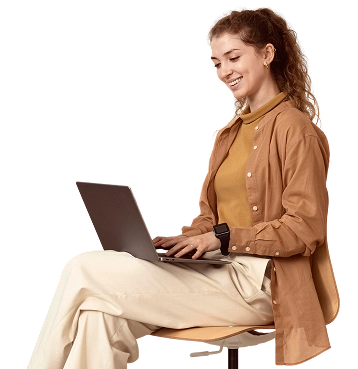 Young businesswoman working indoors from laptop